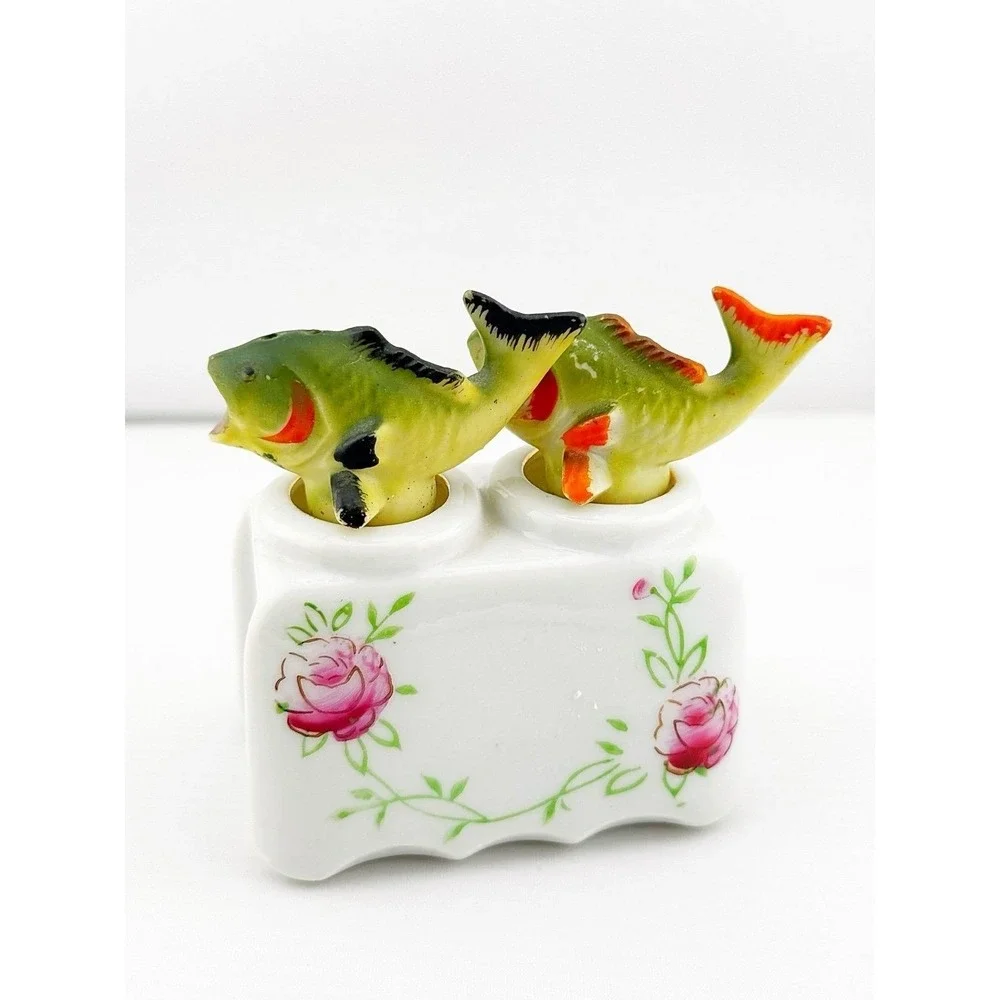 Vintage Japanese porcelain nodder fish salt & pepper shakers with a floral base